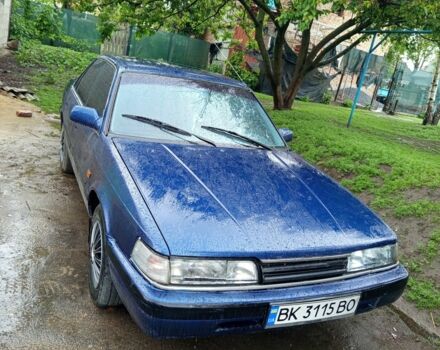 Синий Мазда 626, объемом двигателя 1.8 л и пробегом 300 тыс. км за 1300 $, фото 1 на Automoto.ua