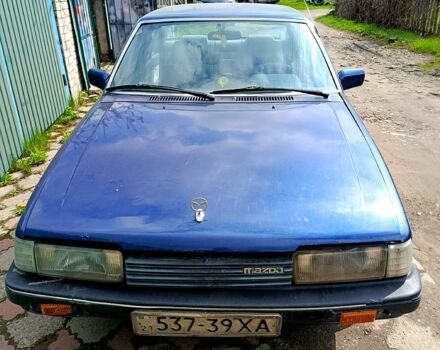 Синий Мазда 626, объемом двигателя 2 л и пробегом 300 тыс. км за 550 $, фото 1 на Automoto.ua