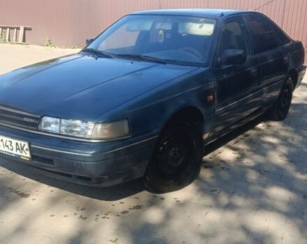 Синий Мазда 626, объемом двигателя 2 л и пробегом 320 тыс. км за 752 $, фото 1 на Automoto.ua