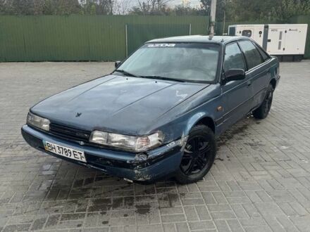 Синий Мазда 626, объемом двигателя 2 л и пробегом 999 тыс. км за 600 $, фото 1 на Automoto.ua