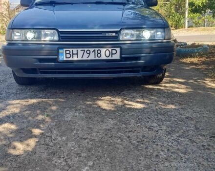 Синий Мазда 626, объемом двигателя 2.2 л и пробегом 467 тыс. км за 2000 $, фото 1 на Automoto.ua