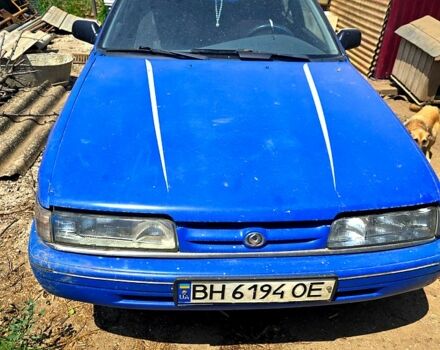 Синий Мазда 626, объемом двигателя 2.2 л и пробегом 450 тыс. км за 1000 $, фото 1 на Automoto.ua