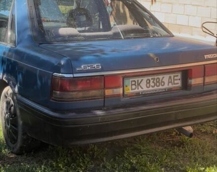 Синий Мазда 626, объемом двигателя 2 л и пробегом 100 тыс. км за 460 $, фото 1 на Automoto.ua