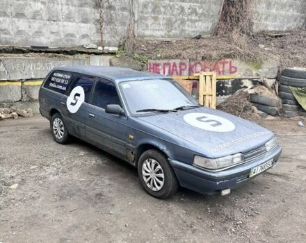 Синий Мазда 626, объемом двигателя 2 л и пробегом 300 тыс. км за 600 $, фото 1 на Automoto.ua