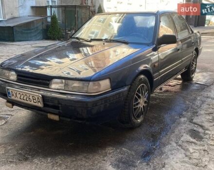 Синий Мазда 626, объемом двигателя 1.8 л и пробегом 300 тыс. км за 1500 $, фото 1 на Automoto.ua