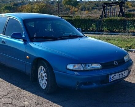 Синий Мазда 626, объемом двигателя 2 л и пробегом 300 тыс. км за 1014 $, фото 1 на Automoto.ua