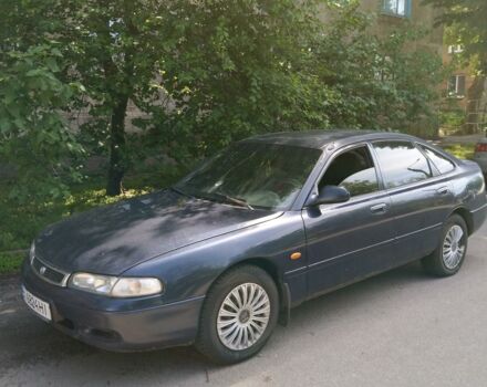 Синий Мазда 626, объемом двигателя 1.8 л и пробегом 420 тыс. км за 1500 $, фото 1 на Automoto.ua