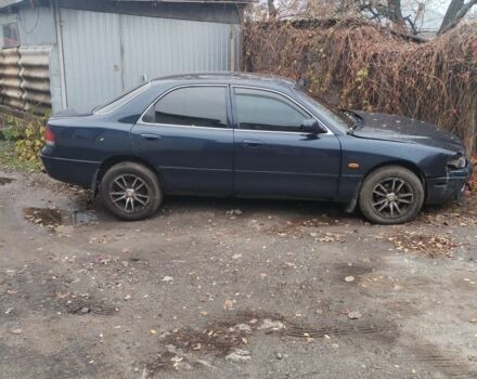 Синий Мазда 626, объемом двигателя 2 л и пробегом 400 тыс. км за 952 $, фото 1 на Automoto.ua