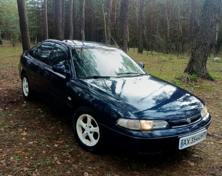 Синий Мазда 626, объемом двигателя 1.8 л и пробегом 206 тыс. км за 1450 $, фото 1 на Automoto.ua