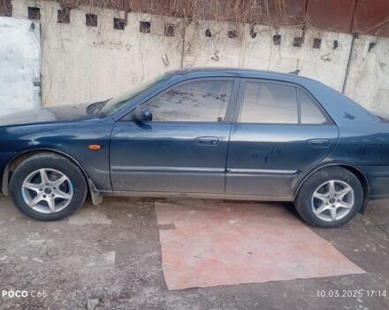Синій Мазда 626, об'ємом двигуна 2 л та пробігом 495 тис. км за 1502 $, фото 1 на Automoto.ua