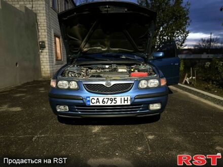 Синий Мазда 626, объемом двигателя 2 л и пробегом 287 тыс. км за 3200 $, фото 1 на Automoto.ua