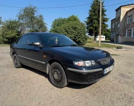 Синий Мазда 626, объемом двигателя 1.8 л и пробегом 200 тыс. км за 1556 $, фото 1 на Automoto.ua