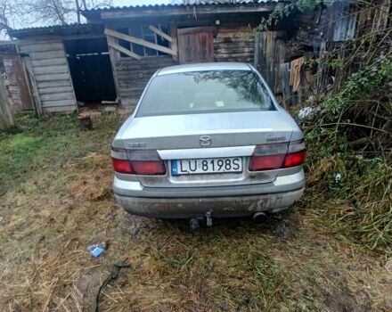 Синий Мазда 626, объемом двигателя 2 л и пробегом 300 тыс. км за 946 $, фото 1 на Automoto.ua