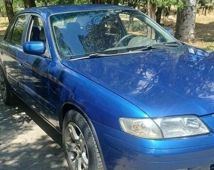 Синий Мазда 626, объемом двигателя 1.7 л и пробегом 326 тыс. км за 1900 $, фото 1 на Automoto.ua