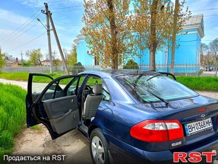 Синій Мазда 626, об'ємом двигуна 2 л та пробігом 246 тис. км за 2500 $, фото 1 на Automoto.ua