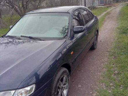 Синій Мазда 626, об'ємом двигуна 2 л та пробігом 320 тис. км за 2800 $, фото 1 на Automoto.ua