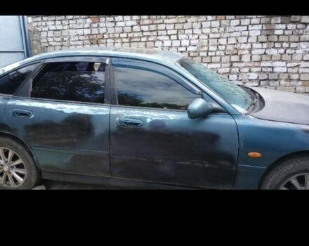 Зеленый Мазда 626, объемом двигателя 2.5 л и пробегом 111 тыс. км за 1200 $, фото 1 на Automoto.ua