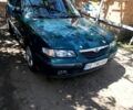 Зеленый Мазда 626, объемом двигателя 2 л и пробегом 520 тыс. км за 2500 $, фото 1 на Automoto.ua