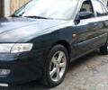 Зеленый Мазда 626, объемом двигателя 2 л и пробегом 312 тыс. км за 2400 $, фото 1 на Automoto.ua