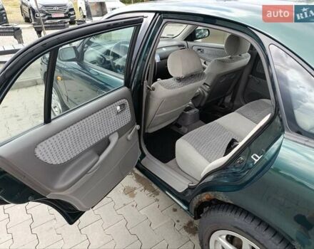 Зеленый Мазда 626, объемом двигателя 2 л и пробегом 235 тыс. км за 3300 $, фото 1 на Automoto.ua