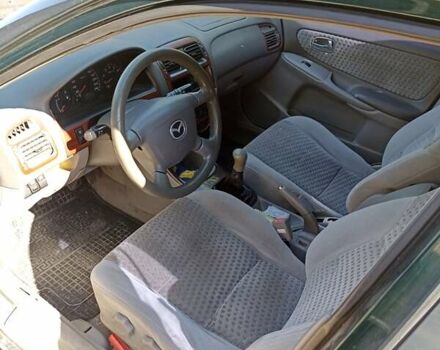 Зеленый Мазда 626, объемом двигателя 2 л и пробегом 280 тыс. км за 1700 $, фото 4 на Automoto.ua