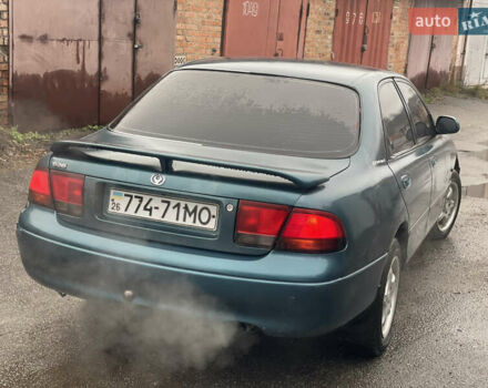 Зеленый Мазда 626, объемом двигателя 1.8 л и пробегом 300 тыс. км за 1099 $, фото 4 на Automoto.ua