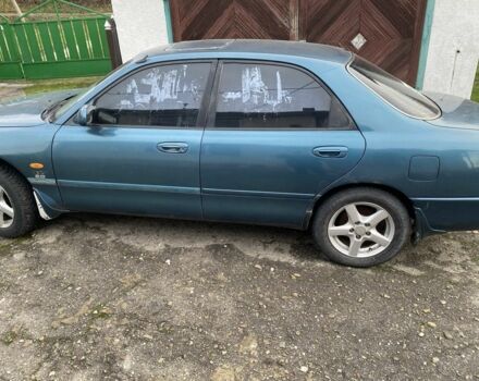 Зеленый Мазда 626, объемом двигателя 2 л и пробегом 470 тыс. км за 900 $, фото 2 на Automoto.ua