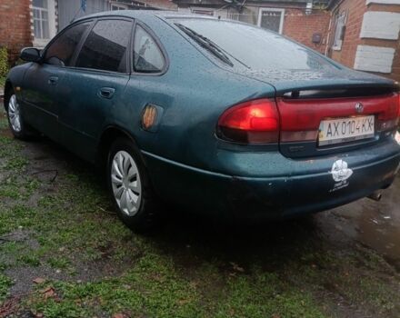 Зеленый Мазда 626, объемом двигателя 2 л и пробегом 350 тыс. км за 1200 $, фото 1 на Automoto.ua