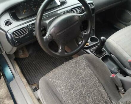 Зеленый Мазда 626, объемом двигателя 2 л и пробегом 345 тыс. км за 800 $, фото 1 на Automoto.ua