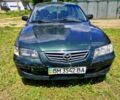 Зеленый Мазда 626, объемом двигателя 2 л и пробегом 300 тыс. км за 850 $, фото 1 на Automoto.ua