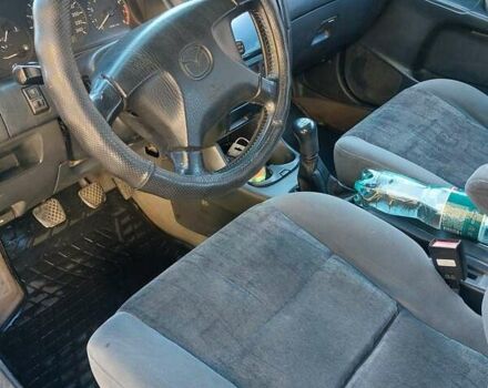 Зеленый Мазда 626, объемом двигателя 2 л и пробегом 378 тыс. км за 2600 $, фото 13 на Automoto.ua