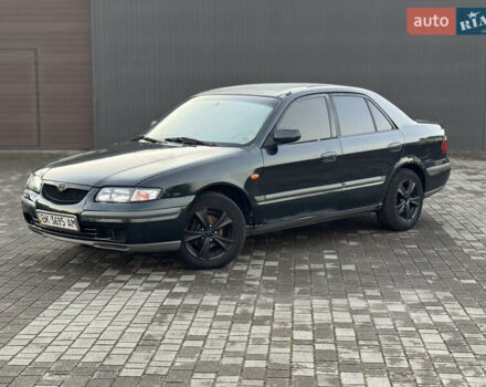 Зеленый Мазда 626, объемом двигателя 2 л и пробегом 309 тыс. км за 2100 $, фото 1 на Automoto.ua