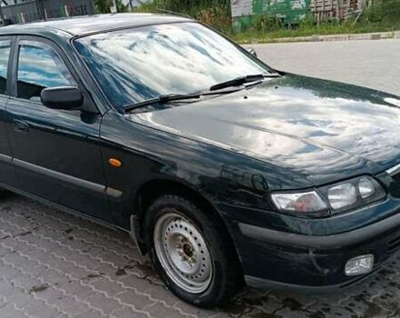 Зеленый Мазда 626, объемом двигателя 1.84 л и пробегом 319 тыс. км за 1700 $, фото 1 на Automoto.ua