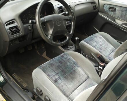 Зеленый Мазда 626, объемом двигателя 2 л и пробегом 250 тыс. км за 3600 $, фото 4 на Automoto.ua