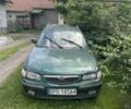 Зеленый Мазда 626, объемом двигателя 2 л и пробегом 350 тыс. км за 500 $, фото 1 на Automoto.ua