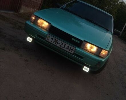 Зеленый Мазда 626, объемом двигателя 2 л и пробегом 175 тыс. км за 1000 $, фото 1 на Automoto.ua