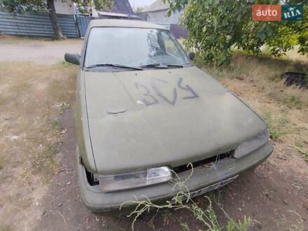 Зеленый Мазда 626, объемом двигателя 2 л и пробегом 350 тыс. км за 700 $, фото 1 на Automoto.ua