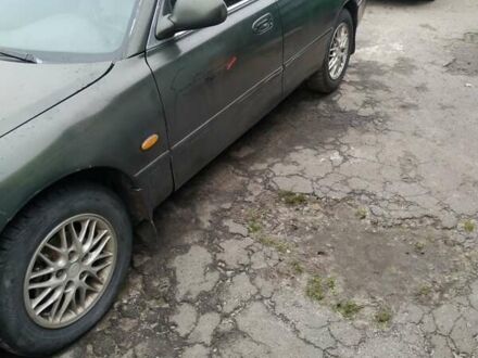 Зеленый Мазда 626, объемом двигателя 2 л и пробегом 345 тыс. км за 800 $, фото 1 на Automoto.ua