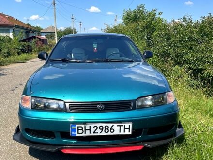 Зелений Мазда 626, об'ємом двигуна 2 л та пробігом 340 тис. км за 2100 $, фото 1 на Automoto.ua