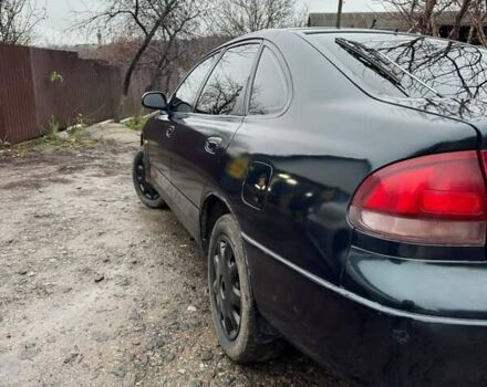 Зеленый Мазда 626, объемом двигателя 2 л и пробегом 320 тыс. км за 1500 $, фото 1 на Automoto.ua