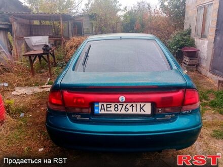 Зеленый Мазда 626, объемом двигателя 1.8 л и пробегом 150 тыс. км за 2400 $, фото 1 на Automoto.ua