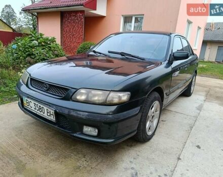 Зеленый Мазда 626, объемом двигателя 2 л и пробегом 270 тыс. км за 1800 $, фото 1 на Automoto.ua