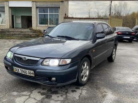 Зеленый Мазда 626, объемом двигателя 2 л и пробегом 200 тыс. км за 1452 $, фото 1 на Automoto.ua