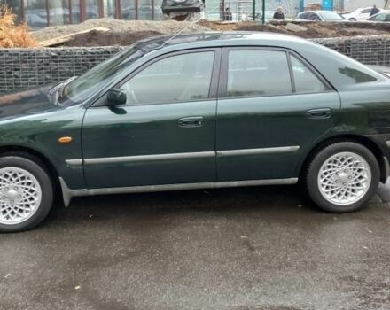 Зеленый Мазда 626, объемом двигателя 2 л и пробегом 250 тыс. км за 3600 $, фото 1 на Automoto.ua