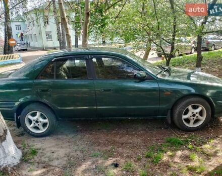 Зеленый Мазда 626, объемом двигателя 2 л и пробегом 300 тыс. км за 1500 $, фото 1 на Automoto.ua