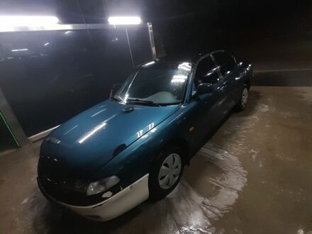 Зелений Мазда 626, об'ємом двигуна 2 л та пробігом 555 тис. км за 413 $, фото 1 на Automoto.ua