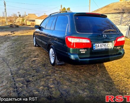 Зеленый Мазда 626, объемом двигателя 2 л и пробегом 210 тыс. км за 3800 $, фото 1 на Automoto.ua