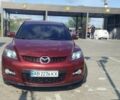 Красный Мазда СХ-7, объемом двигателя 2.3 л и пробегом 261 тыс. км за 7299 $, фото 1 на Automoto.ua