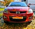 Красный Мазда СХ-7, объемом двигателя 2.3 л и пробегом 240 тыс. км за 7500 $, фото 1 на Automoto.ua