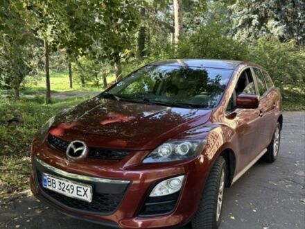 Красный Мазда СХ-7, объемом двигателя 2.5 л и пробегом 200 тыс. км за 10447 $, фото 1 на Automoto.ua